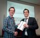  Dr Tadhg Sullivan receives his iPad from Dr Mark Murphy after his name was drawn from the list of participants in the IMO benchamrk study